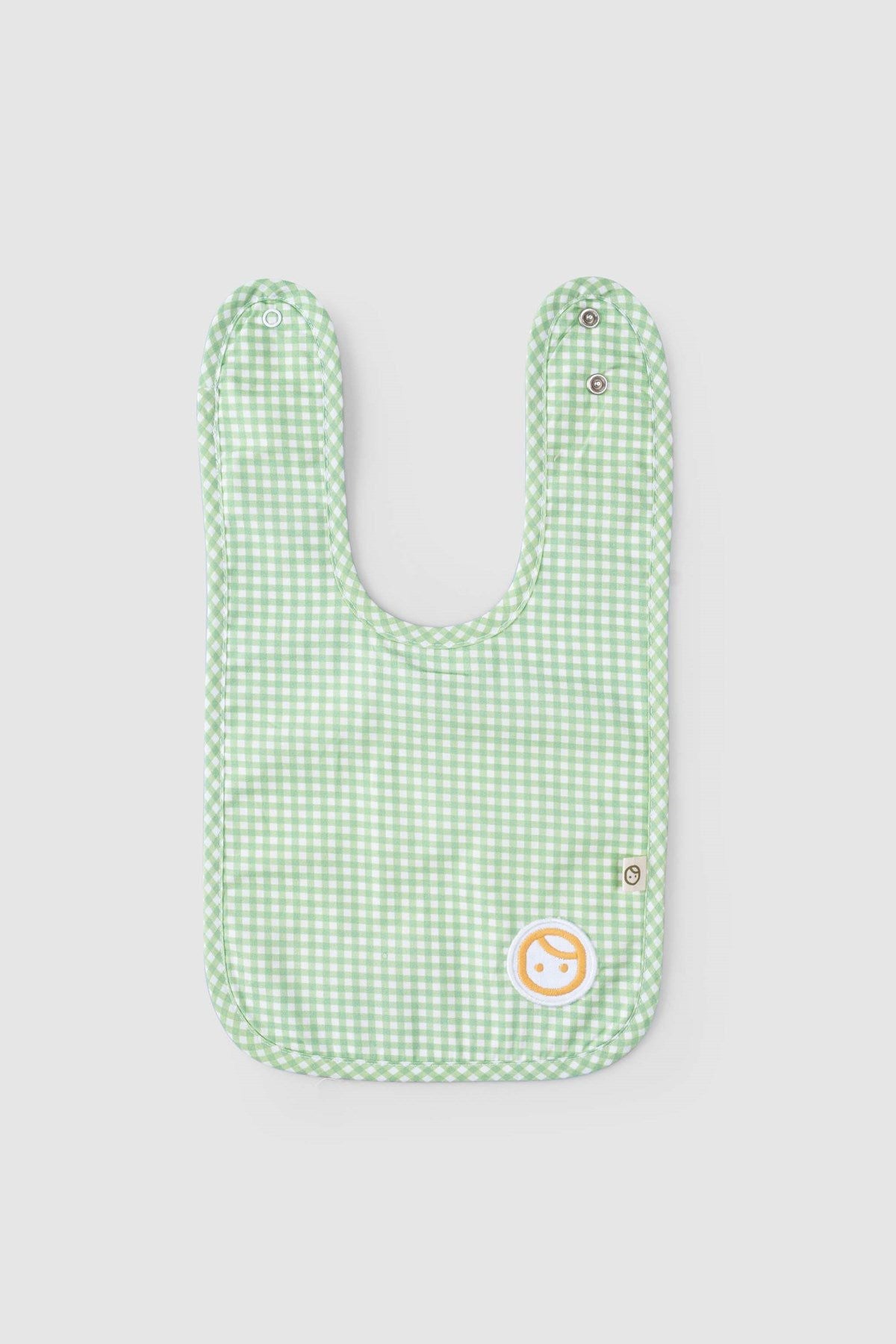 folded organic baby bib green picnic fabric
