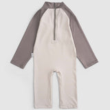 baby wearing brown swim shorts summer outfit